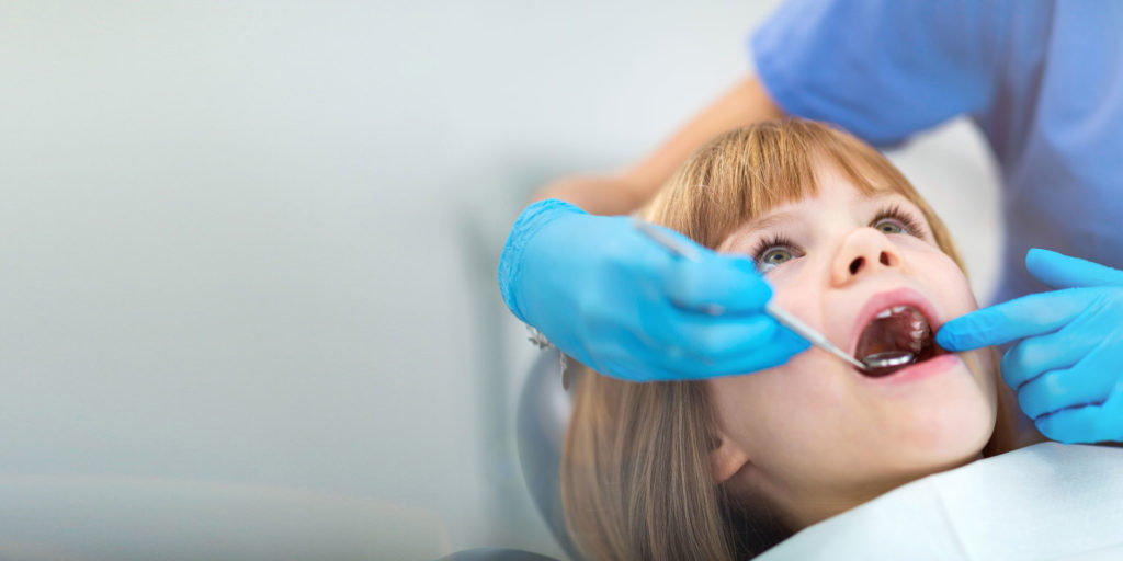 young dental patient undergoing procedure
